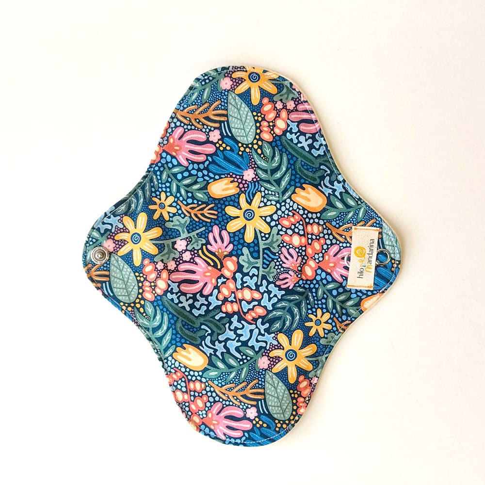 compresa de tela reutilizable de dia de algodón orgánico hilo mandarina estampado selva azul